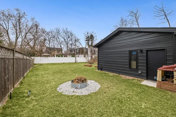 a backyard of house with a yard