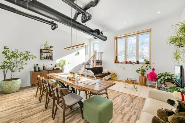 a living room with furniture and flowers