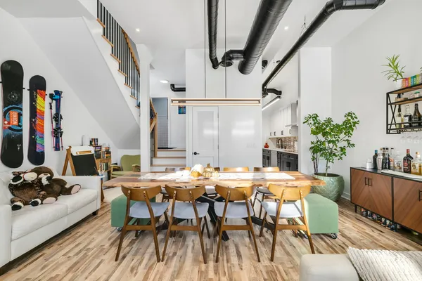 a view of a dining room with furniture and wooden floor