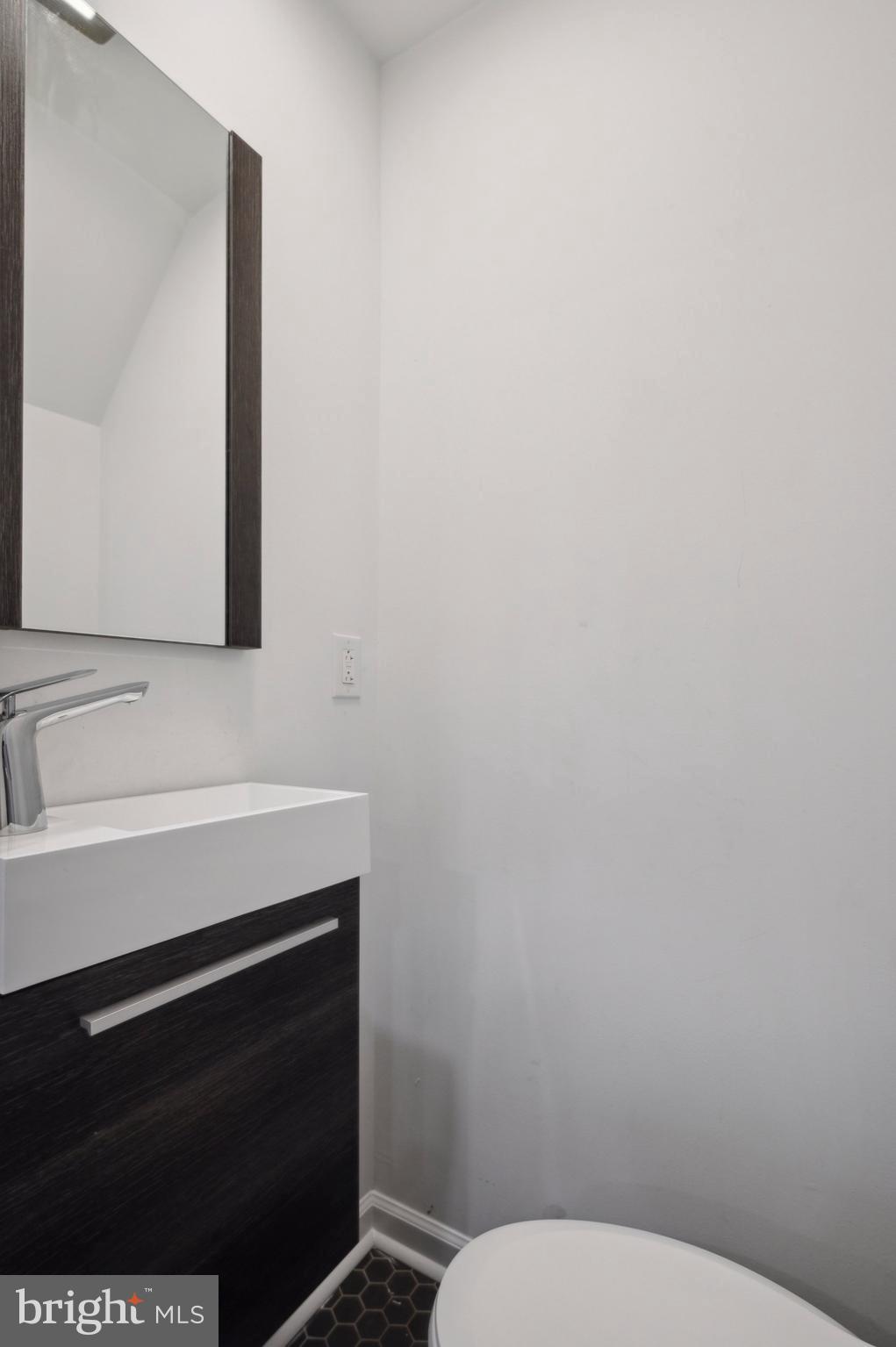 4520 Fernhill Road Philadelphia, PA 19144 - Photo 17 of 30 a bathroom with a toilet and a sink