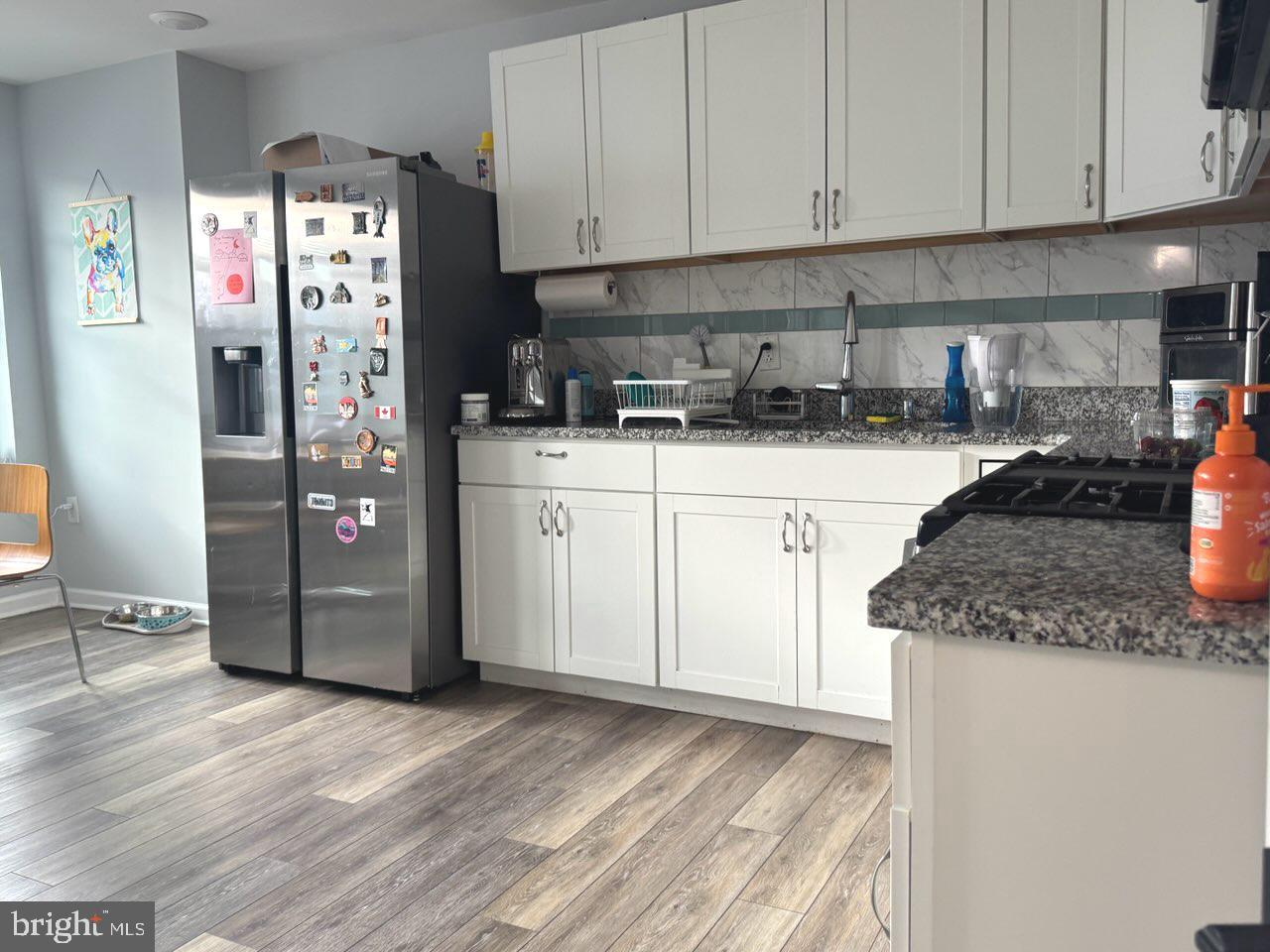 4520 Fernhill Road Philadelphia, PA 19144 - Photo 19 of 30 a kitchen with stainless steel appliances granite countertop a refrigerator sink and cabinets