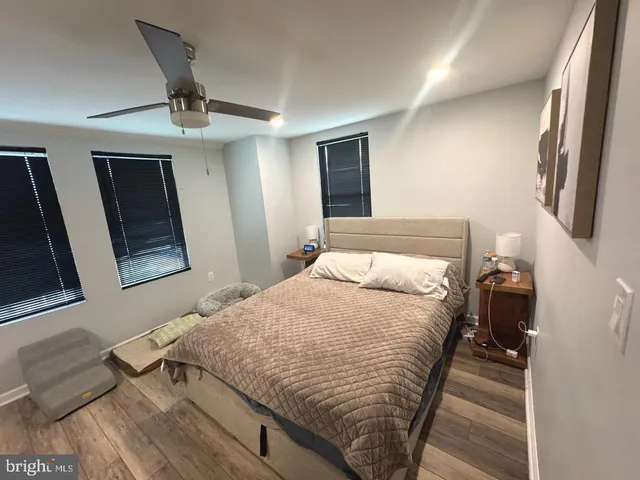 a bedroom with a bed and a mirror