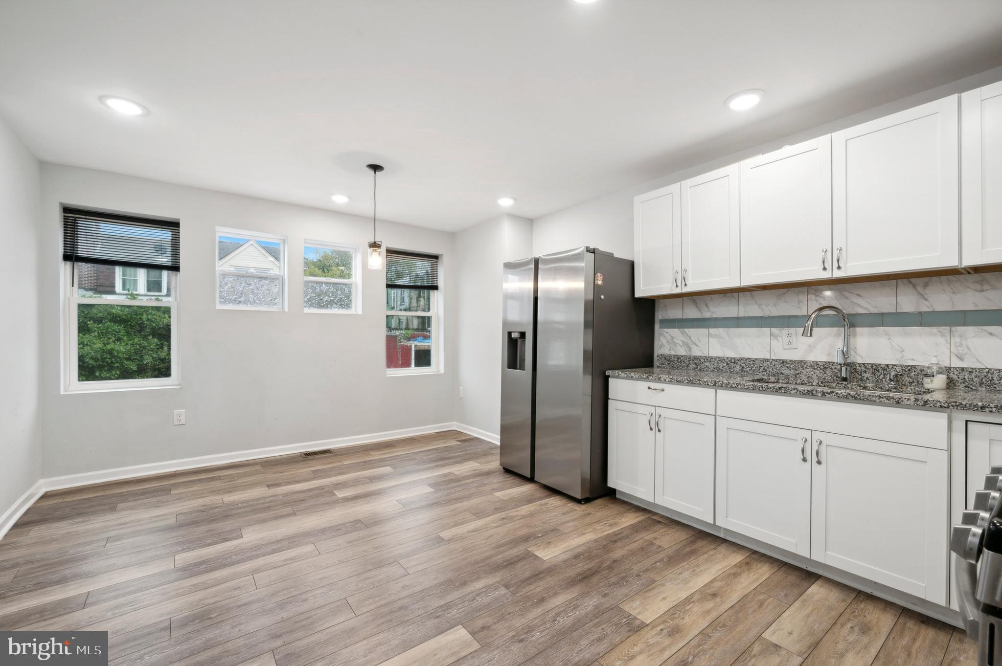 4520 Fernhill Road Philadelphia, PA 19144 - Photo 8 of 30 a kitchen with stainless steel appliances granite countertop a refrigerator and a stove top oven