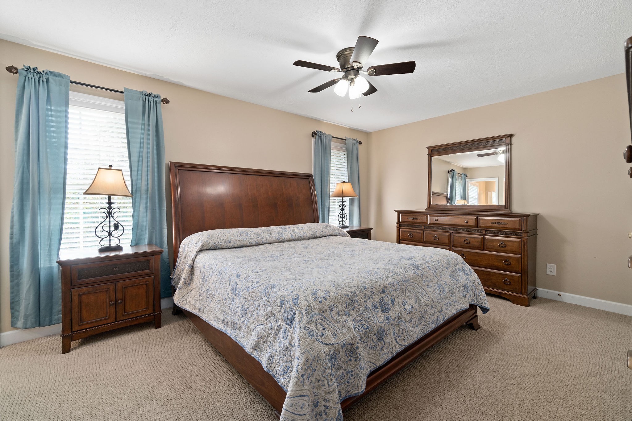 1216 Green Shanty Road Tennessee Ridge, TN 37178 - Photo 13 of 20 a bedroom with a large bed and a chandelier