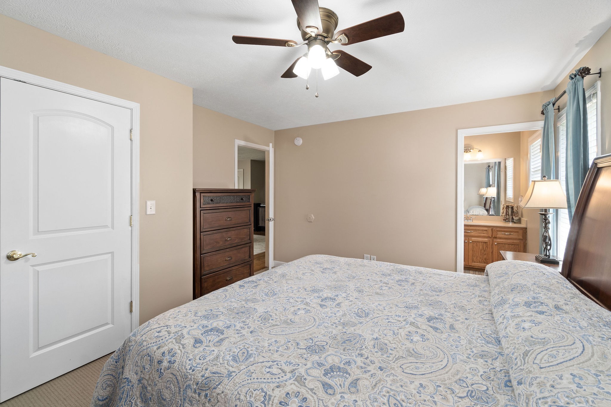 1216 Green Shanty Road Tennessee Ridge, TN 37178 - Photo 14 of 20 a bedroom with a bed and a chandelier