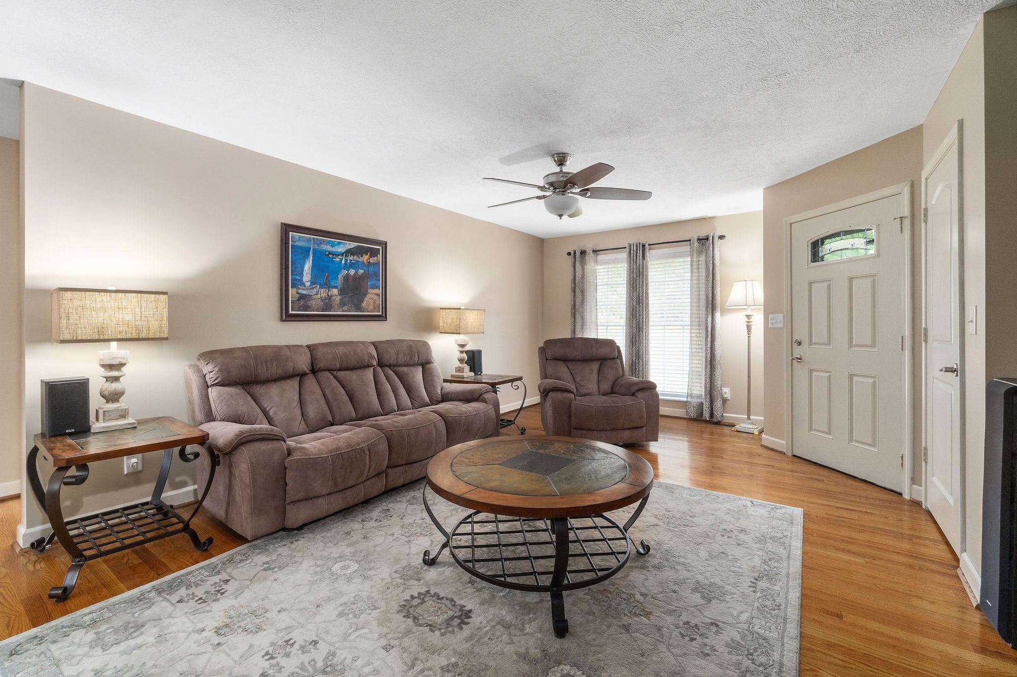 1216 Green Shanty Road Tennessee Ridge, TN 37178 - Photo 4 of 20 a living room with furniture a wooden floor and a chandelier
