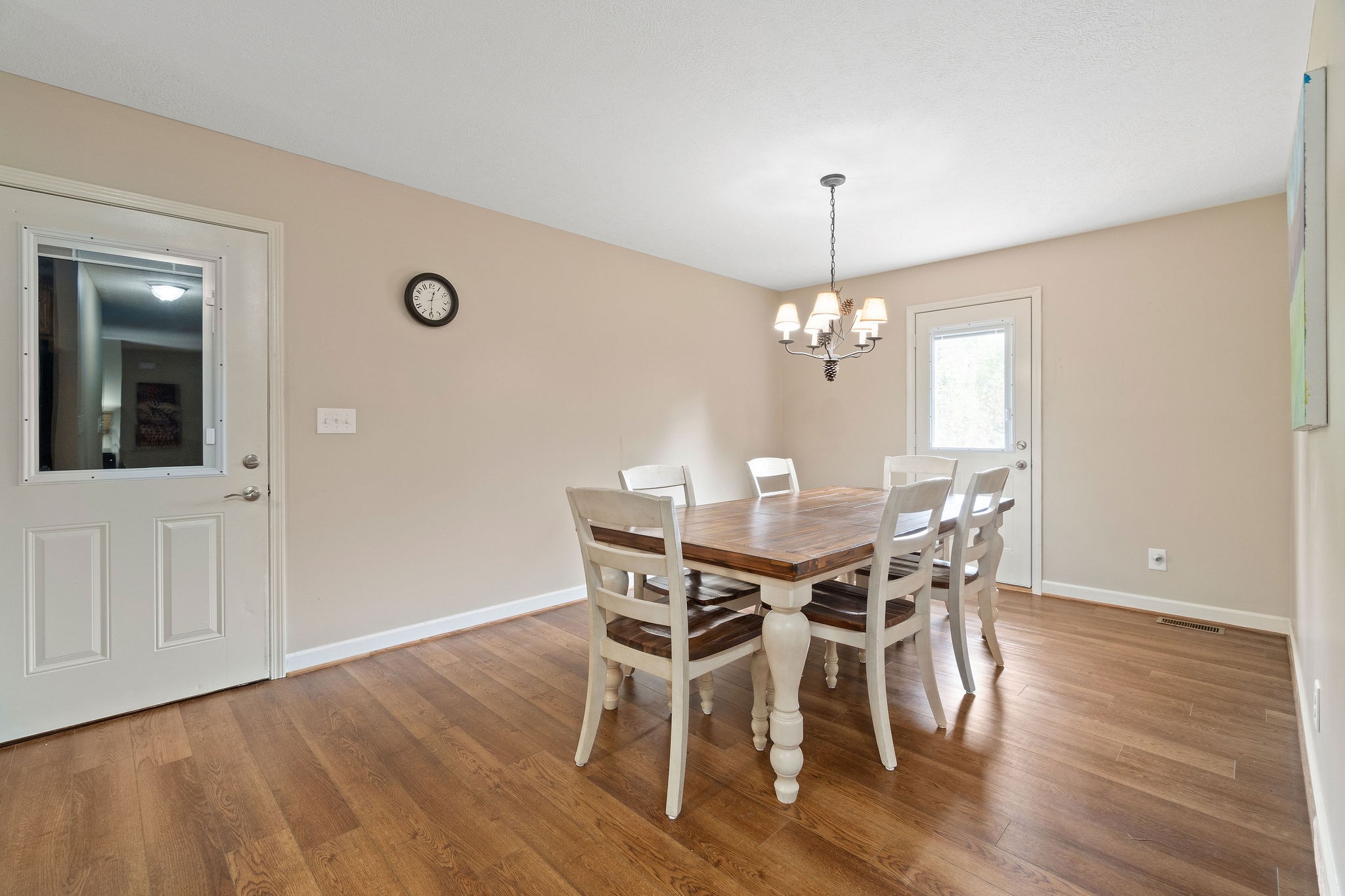 1216 Green Shanty Road Tennessee Ridge, TN 37178 - Photo 7 of 20 a dining room with furniture wooden floor a chandelier