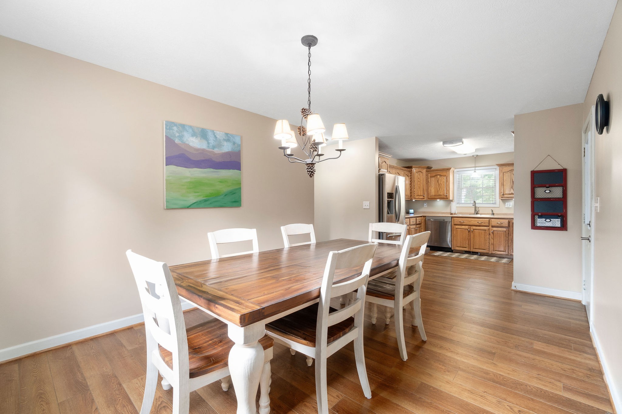 1216 Green Shanty Road Tennessee Ridge, TN 37178 - Photo 8 of 20 a dining room with furniture a chandelier and wooden floor