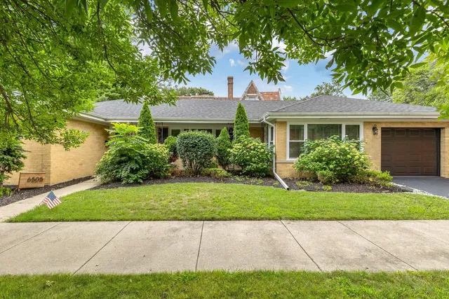 a view of front of house with a yard