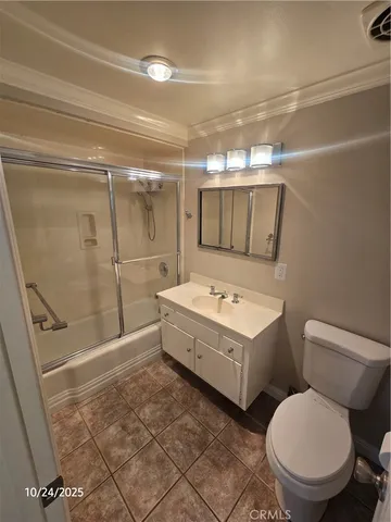 a bathroom with a toilet sink and shower