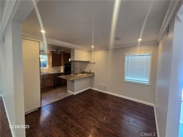 a kitchen with a refrigerator and a sink