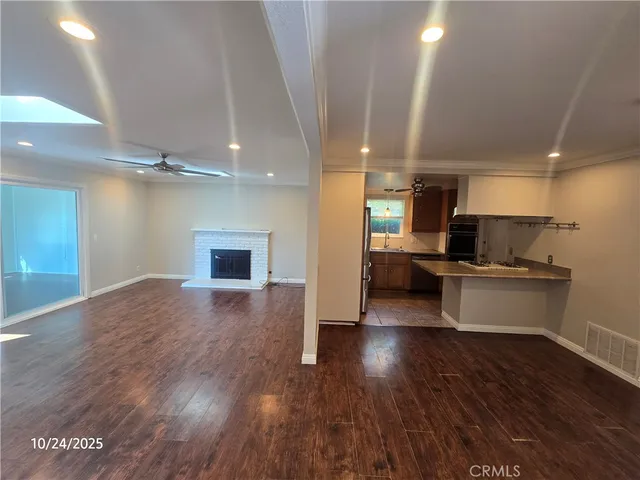 a view of kitchen with furniture and wooden floor