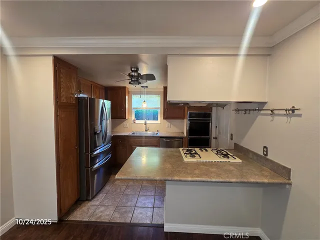 a bathroom with a sink and a refrigerator