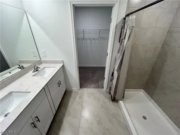 a bathroom with a sink a mirror and a bathtub