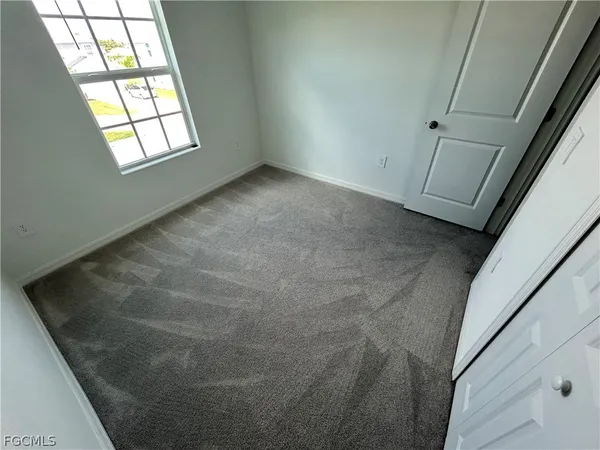 a view of empty room with windows