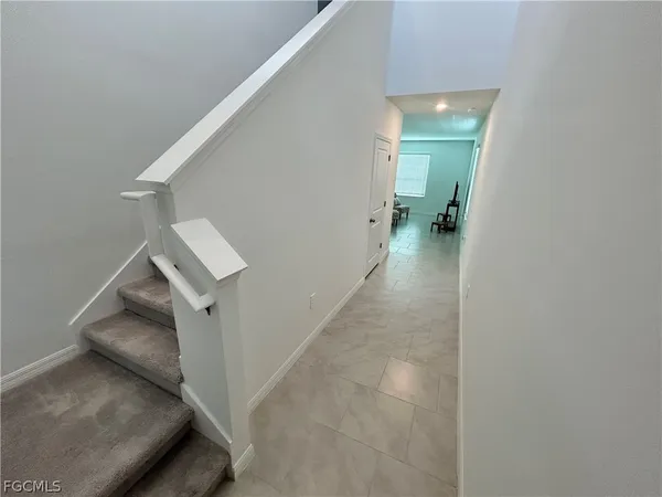 a view of a hallway view with staircase