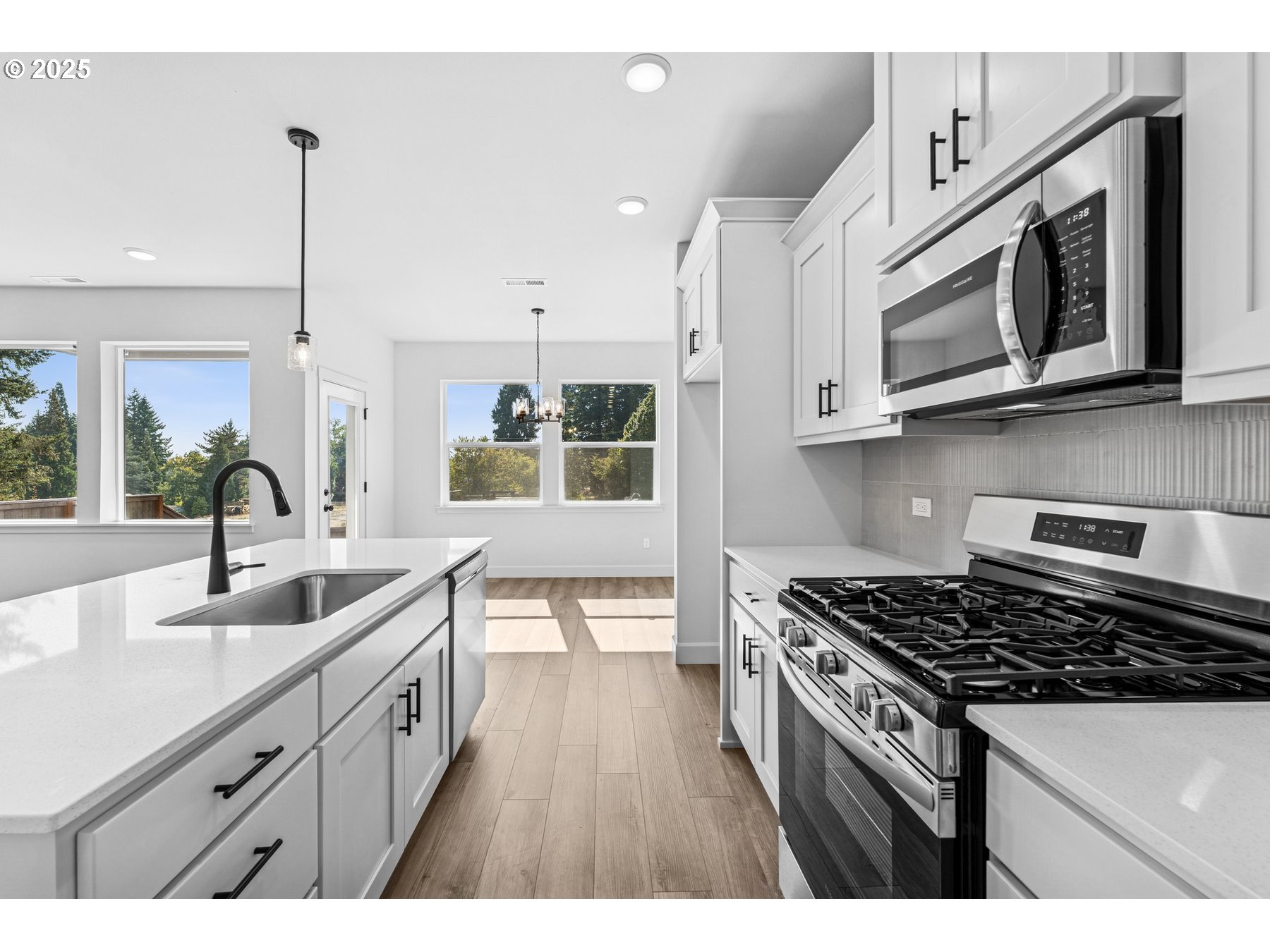 920 Rosebud Court Forest Grove, OR 97116 - Photo 6 of 8 a kitchen with stainless steel appliances granite countertop a sink stove and microwave