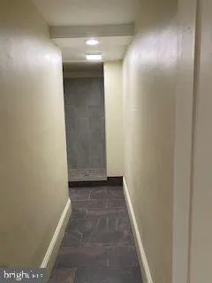 a spacious bathroom with a sink and a mirror