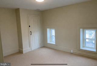 278 A Newtown Road Warminster, PA 18974 - Photo 19 of 21 an empty room with windows and closet
