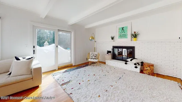 a bedroom with furniture and a fireplace