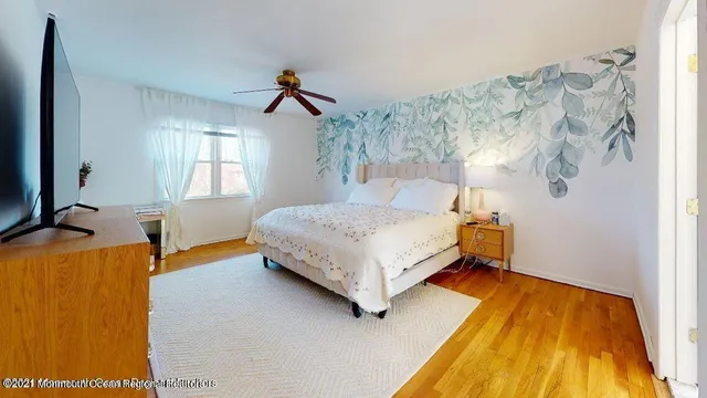 a bedroom with a bed and a table in it