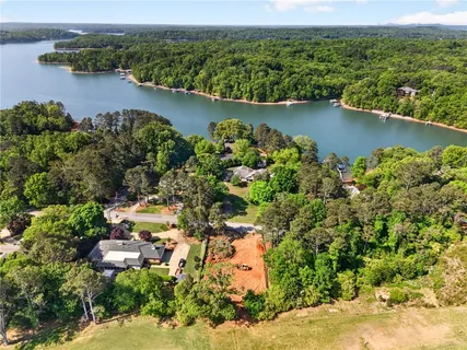 an aerial view of city and lake