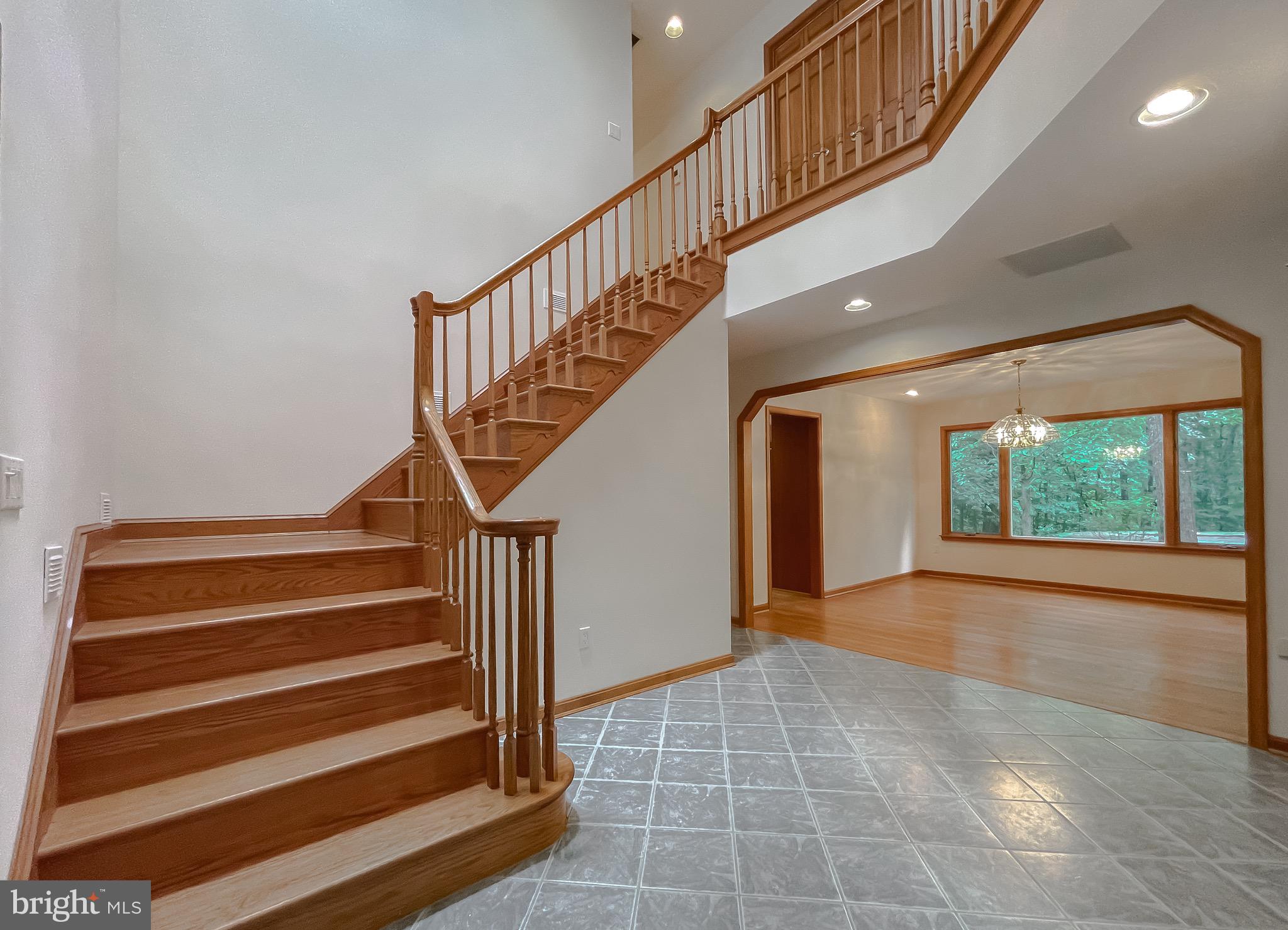 3050 Ross Road St. Leonard, MD 20685 - Photo 16 of 87 a view of entryway and hall with wooden floor