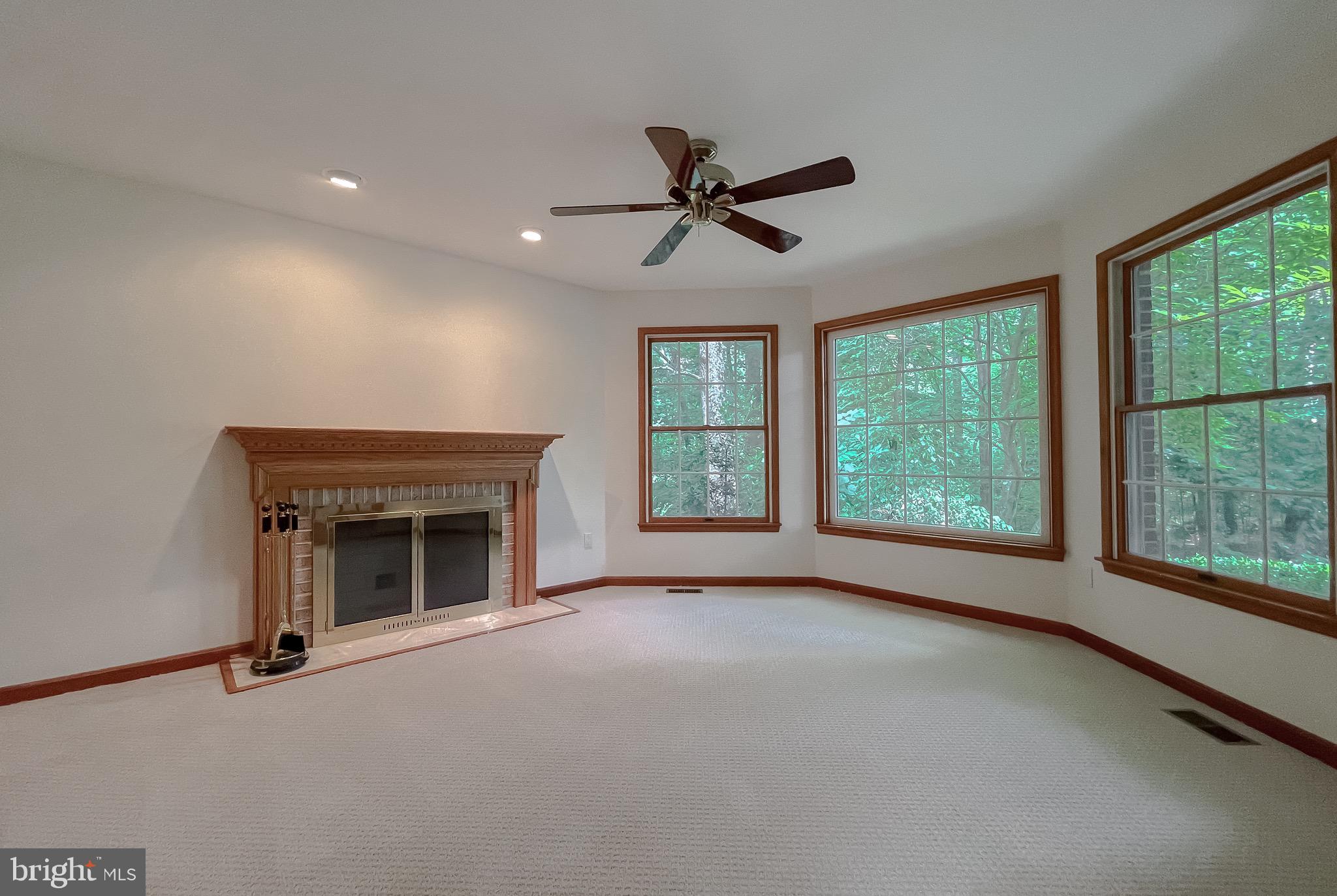 3050 Ross Road St. Leonard, MD 20685 - Photo 18 of 87 a view of empty room with front door and fan