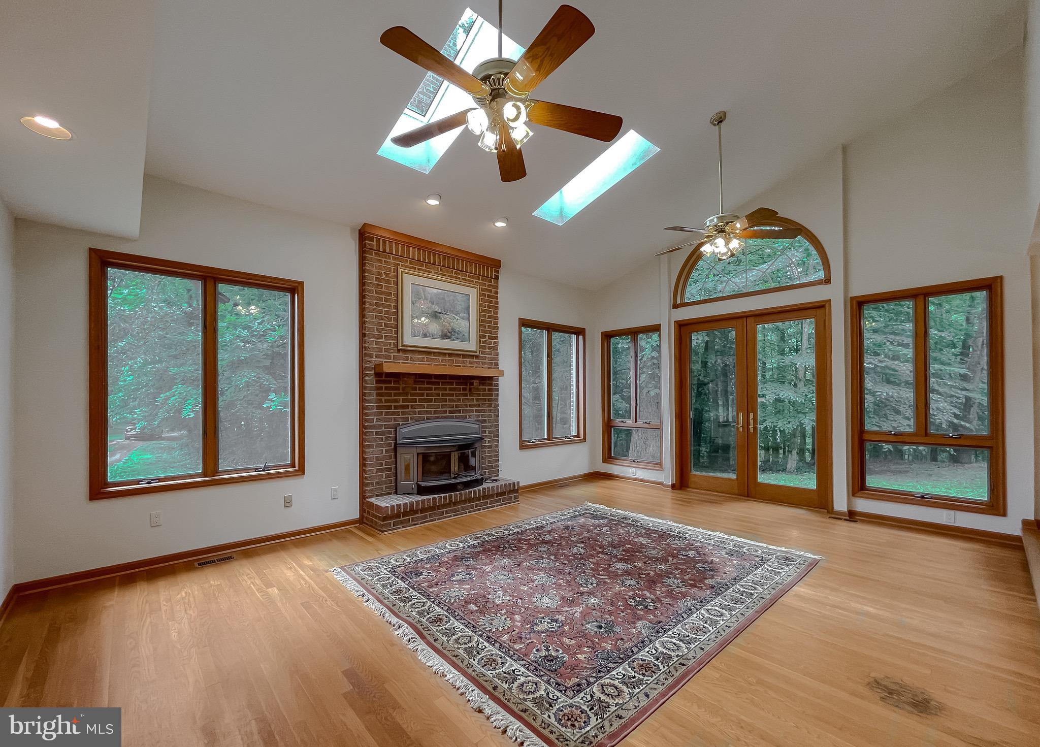 3050 Ross Road St. Leonard, MD 20685 - Photo 20 of 87 a view of an empty room with a fireplace and a window
