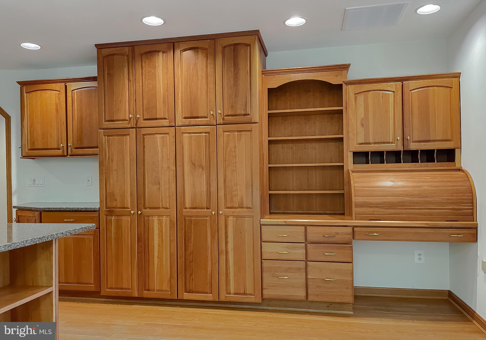 3050 Ross Road St. Leonard, MD 20685 - Photo 28 of 87 a view of an empty room with cabinet and a window