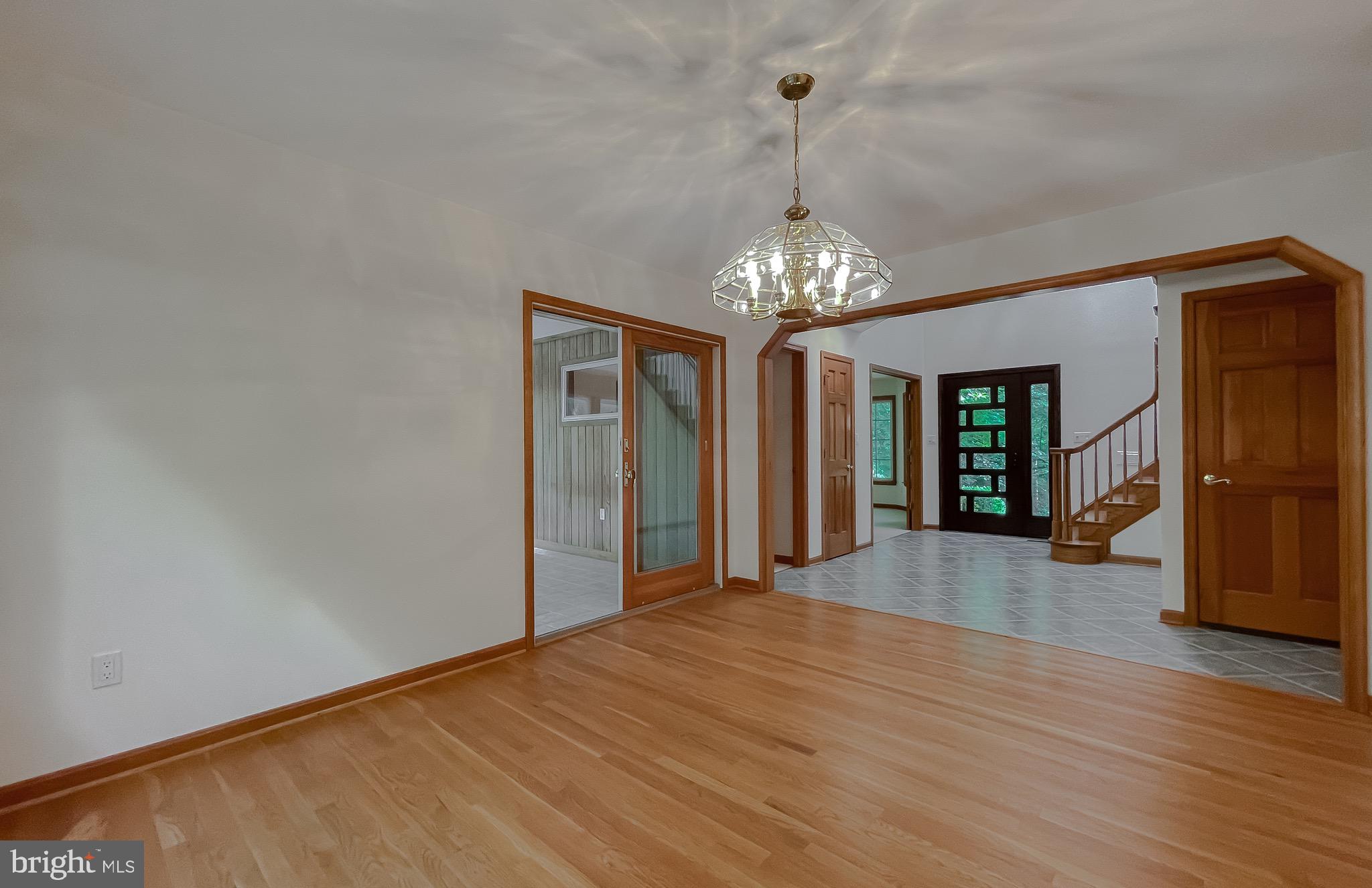 3050 Ross Road St. Leonard, MD 20685 - Photo 31 of 87 a view of a chandelier and window in a room