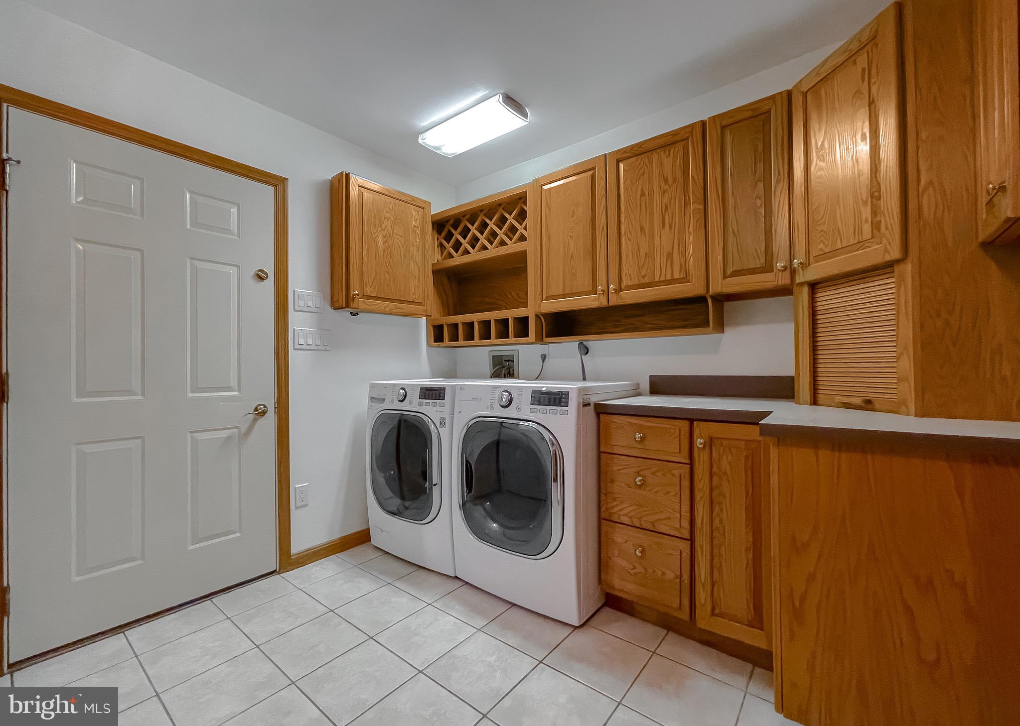 3050 Ross Road St. Leonard, MD 20685 - Photo 34 of 87 a utility room with dryer and washer