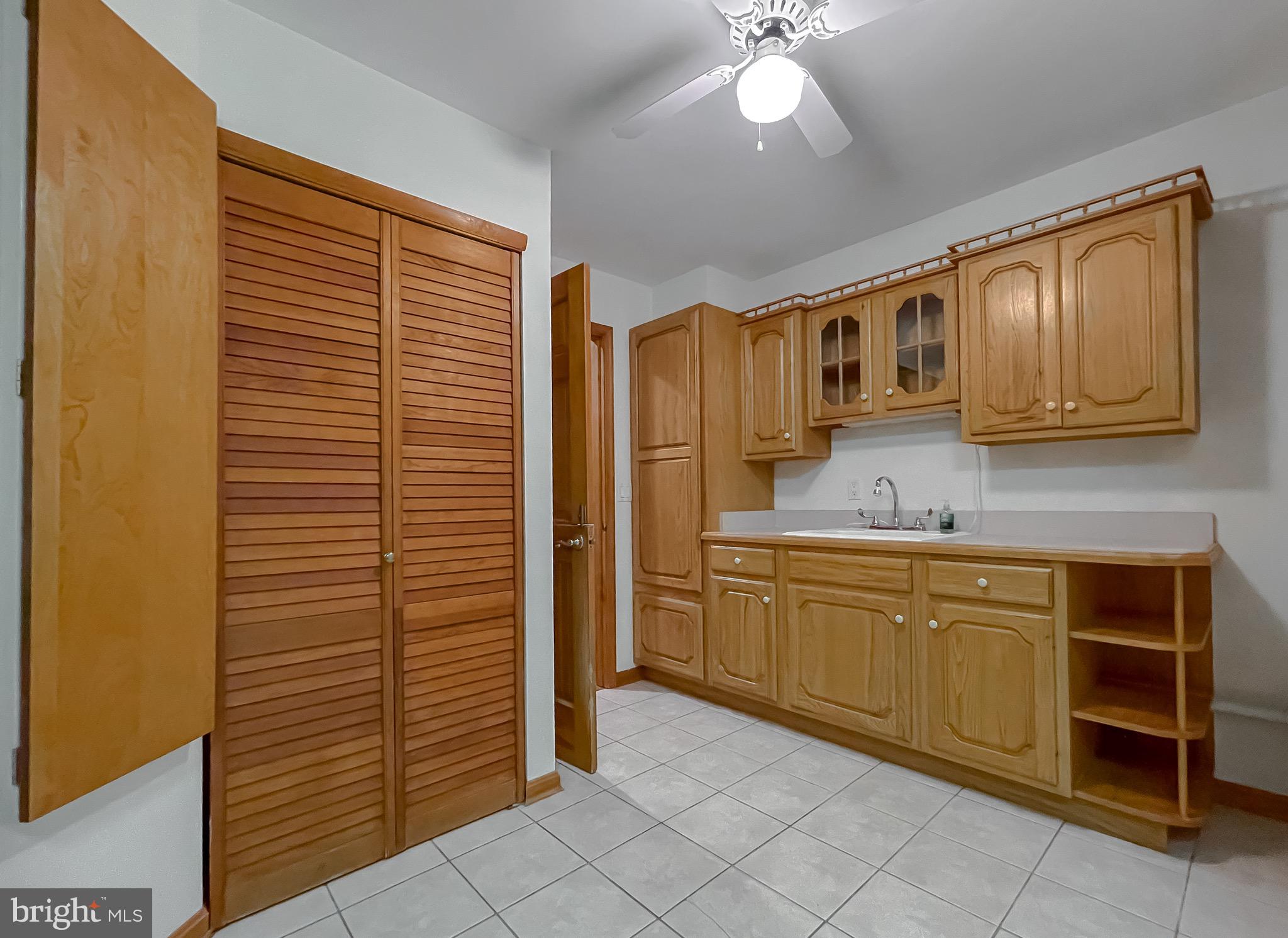 3050 Ross Road St. Leonard, MD 20685 - Photo 35 of 87 a kitchen with stainless steel appliances granite countertop a refrigerator and cabinets