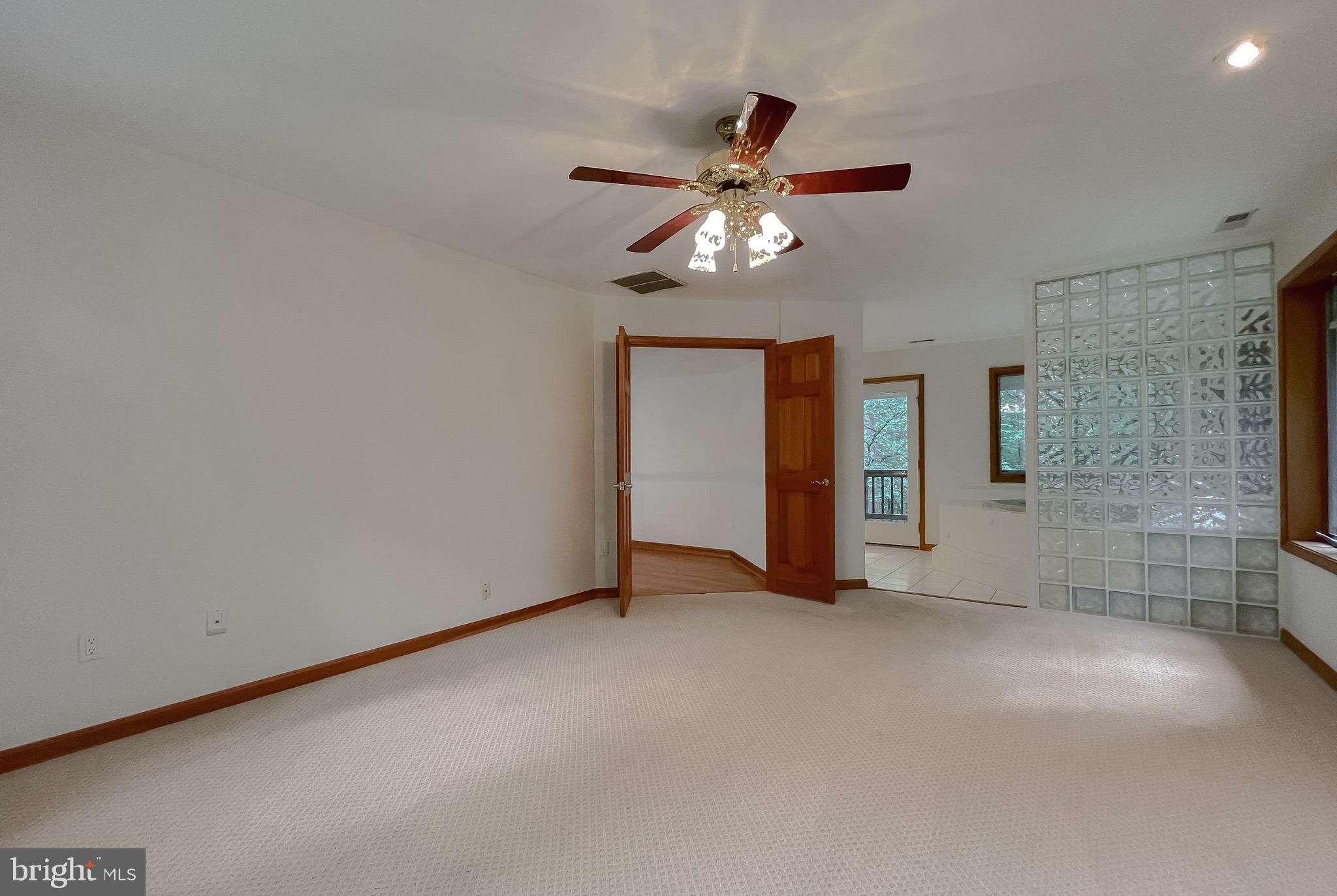 3050 Ross Road St. Leonard, MD 20685 - Photo 38 of 87 a view of a livingroom with a ceiling fan and window