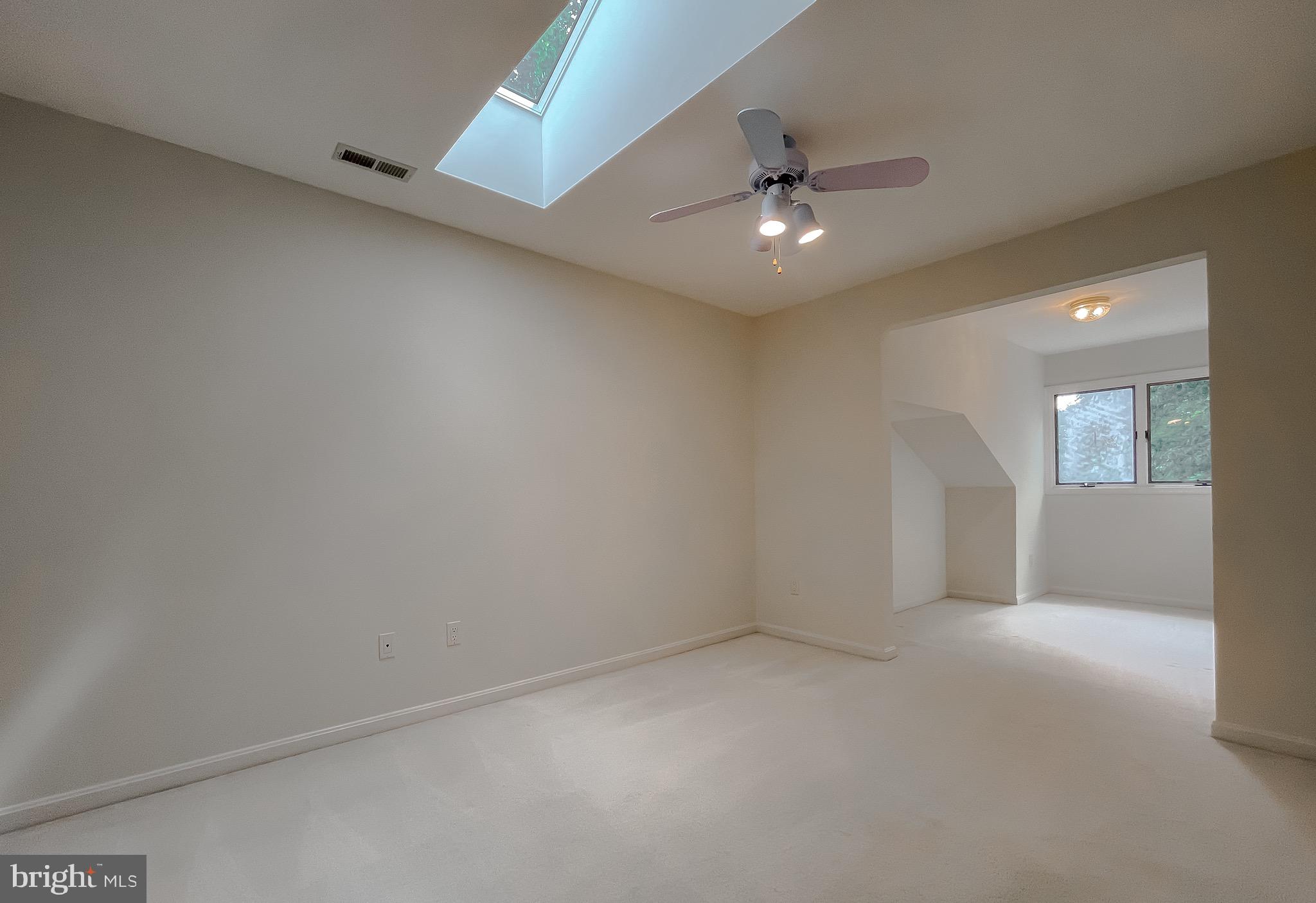 3050 Ross Road St. Leonard, MD 20685 - Photo 49 of 87 an empty room with a ceiling fan and a window