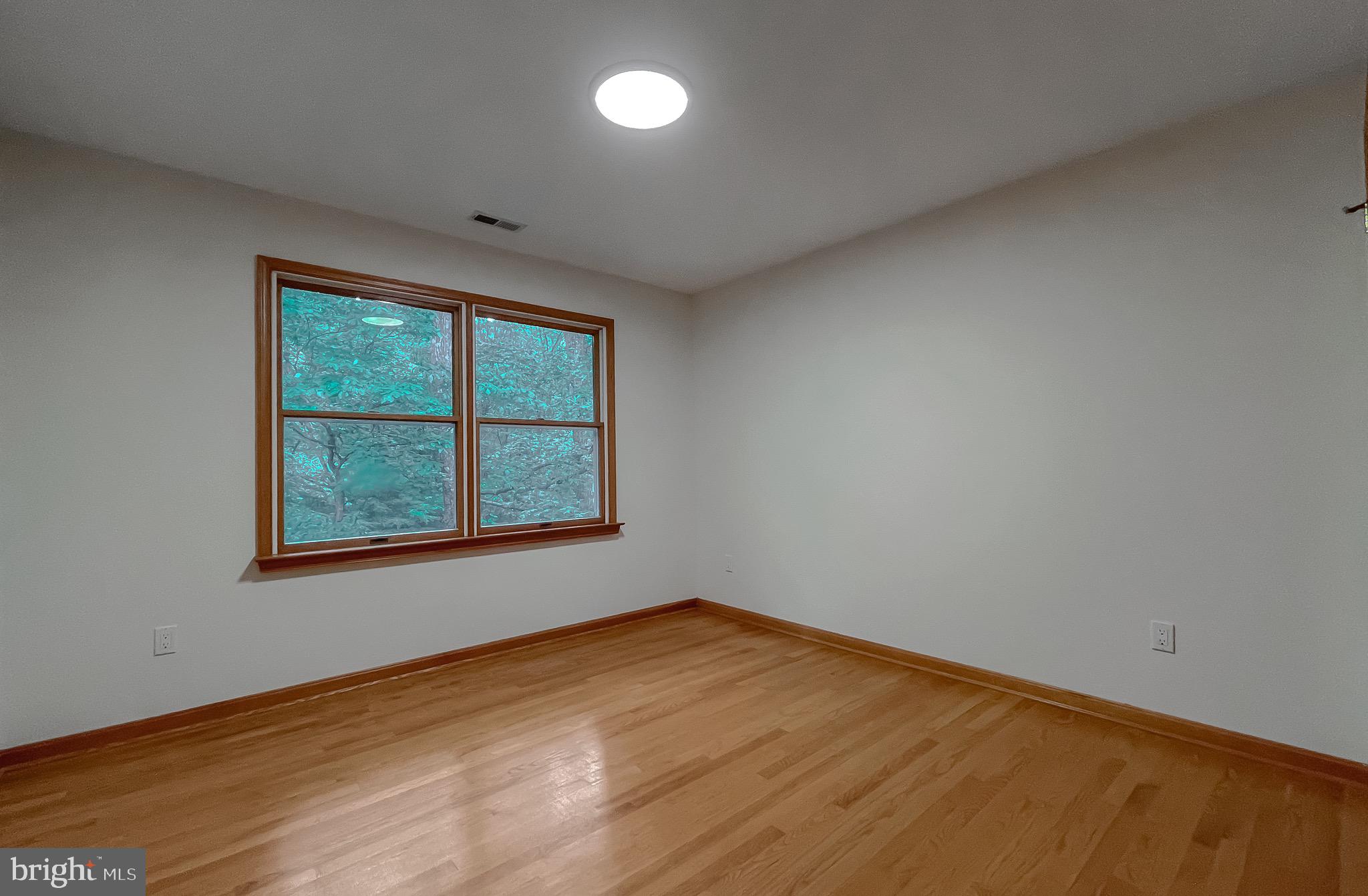 3050 Ross Road St. Leonard, MD 20685 - Photo 53 of 87 an empty room with a window