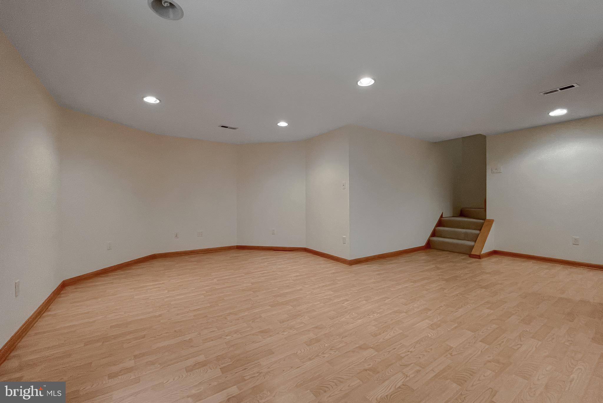 3050 Ross Road St. Leonard, MD 20685 - Photo 57 of 87 a view of an empty room with wooden floor