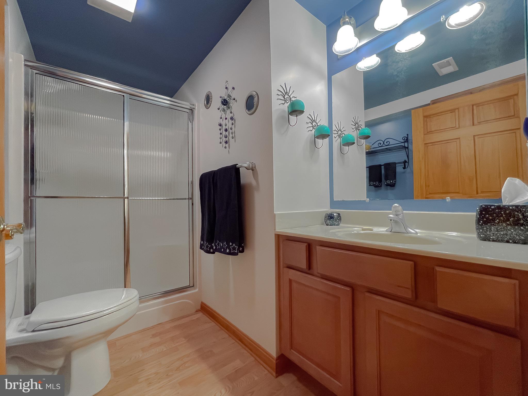 3050 Ross Road St. Leonard, MD 20685 - Photo 60 of 87 a bathroom with a sink and mirror