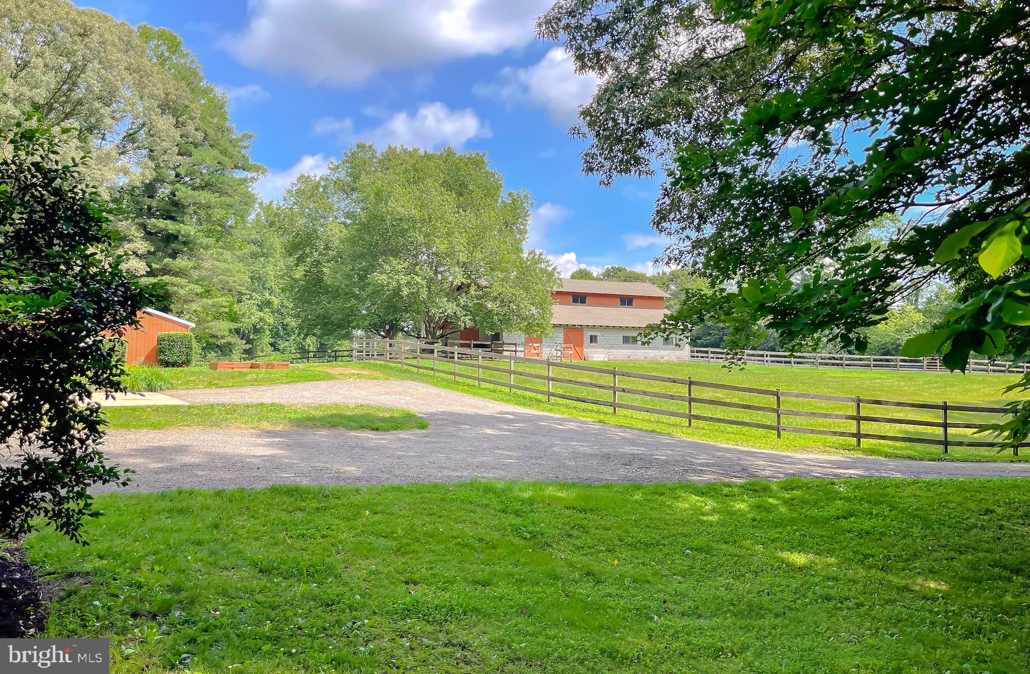 3050 Ross Road St. Leonard, MD 20685 - Photo 68 of 87 a view of a swimming pool with a yard and large trees