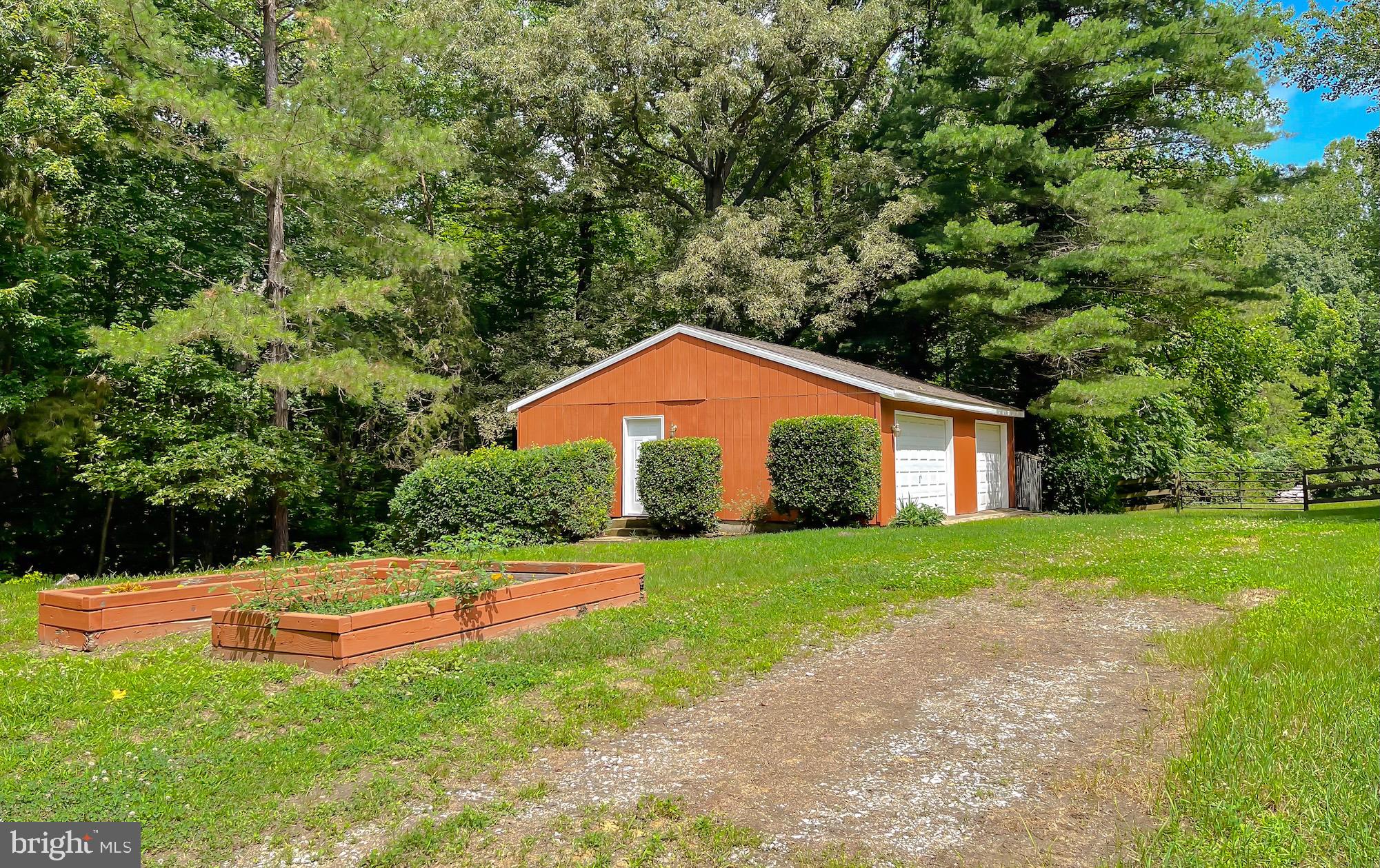 3050 Ross Road St. Leonard, MD 20685 - Photo 76 of 87 a view of a backyard with large trees