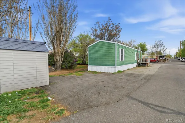 a view of a house with a yard and garage
