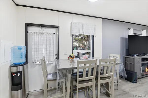 a dining room with furniture and window