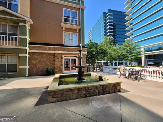 a view of a brick building with many windows