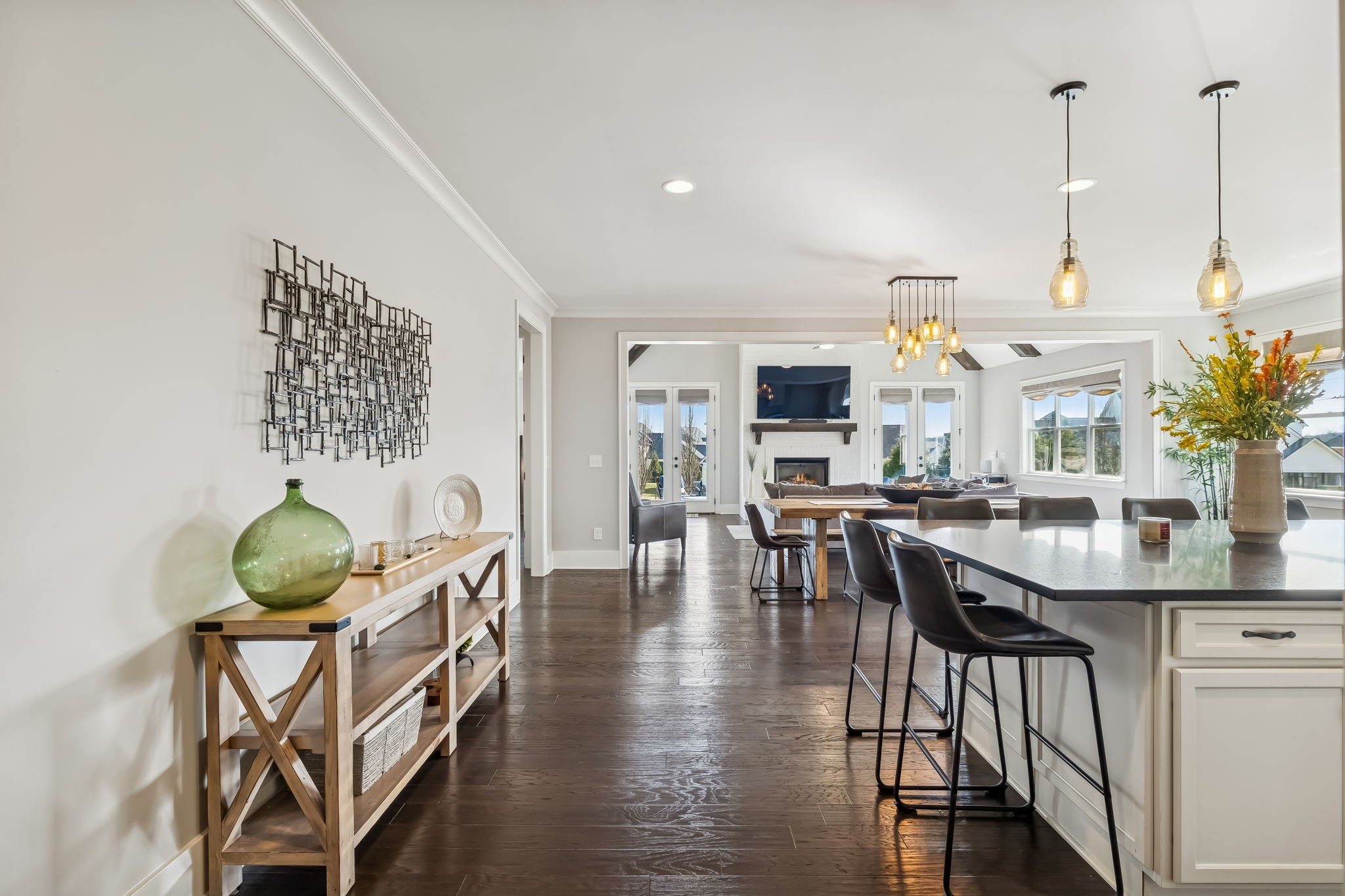 142 Vanner Road Mount Juliet, TN 37122 - Photo 12 of 52 a view of a dining room and livingroom with furniture wooden floor a chandelier