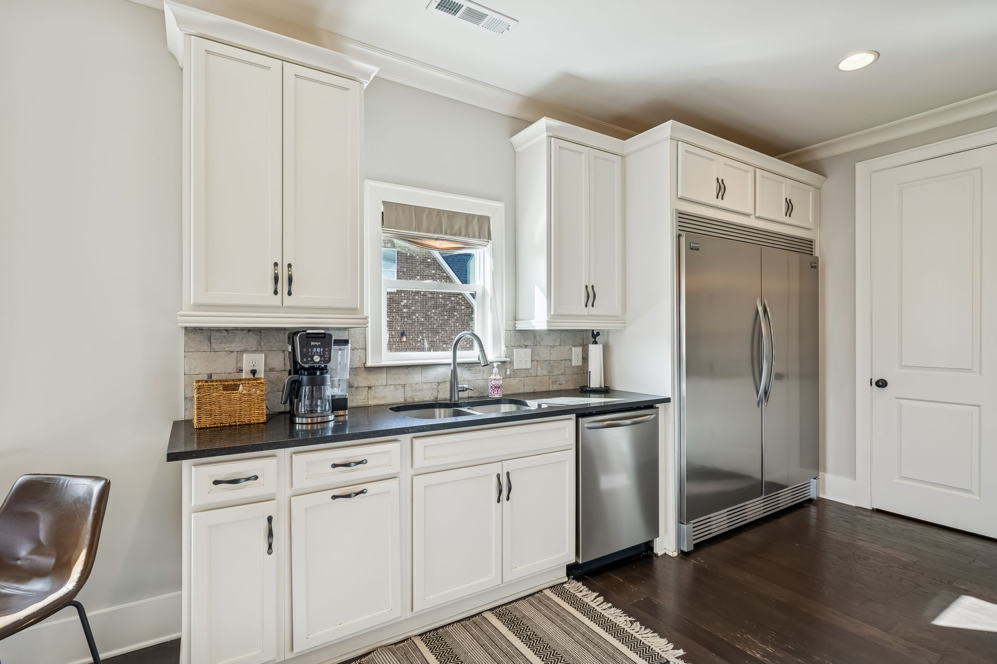 142 Vanner Road Mount Juliet, TN 37122 - Photo 16 of 52 a kitchen with stainless steel appliances white cabinets and a window