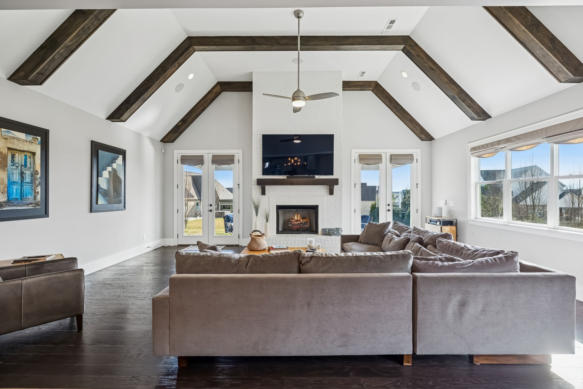 142 Vanner Road Mount Juliet, TN 37122 - Photo 23 of 52 a living room with furniture a flat screen tv and a fireplace