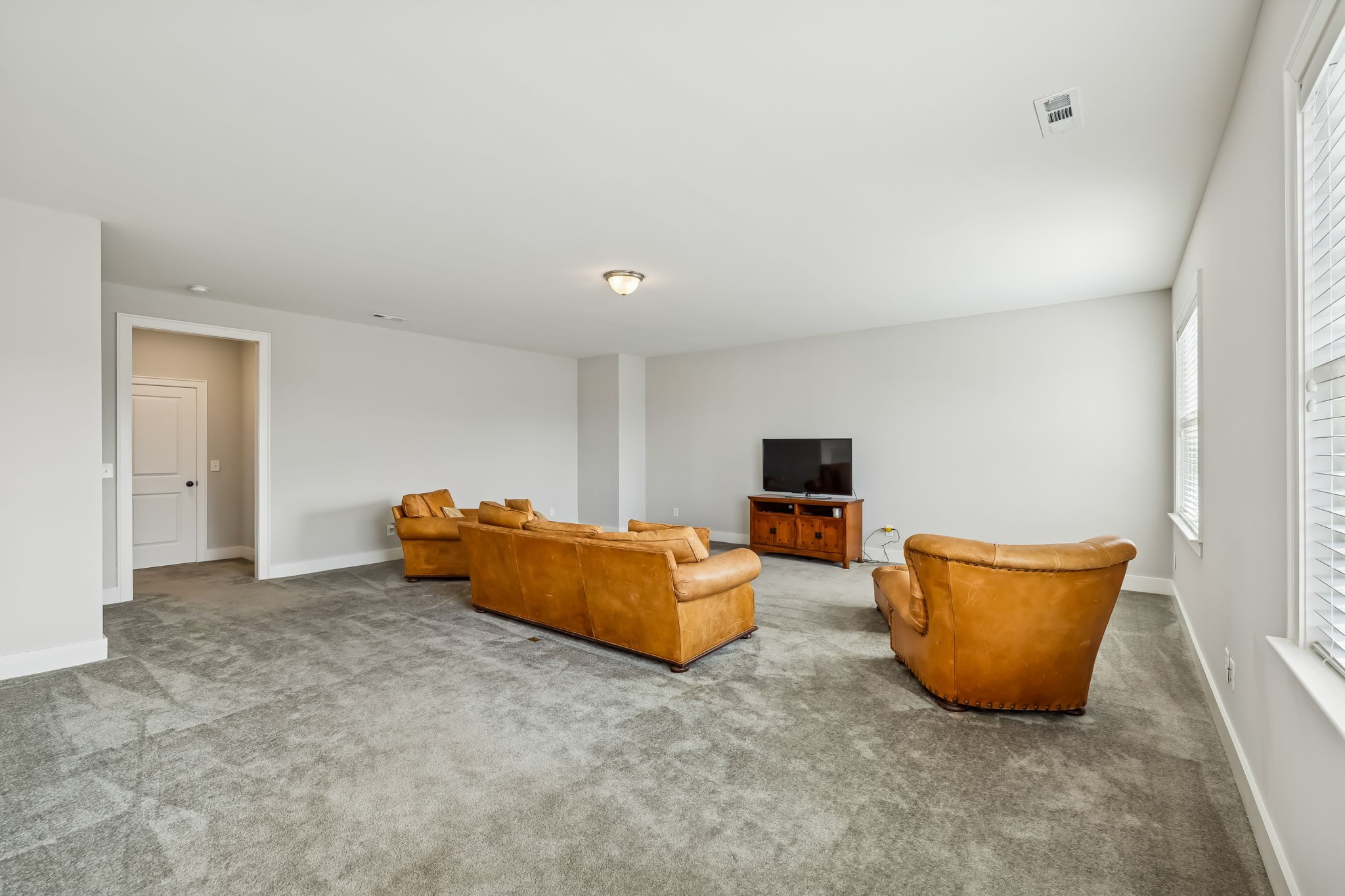142 Vanner Road Mount Juliet, TN 37122 - Photo 34 of 52 a living room with furniture and a flat screen tv