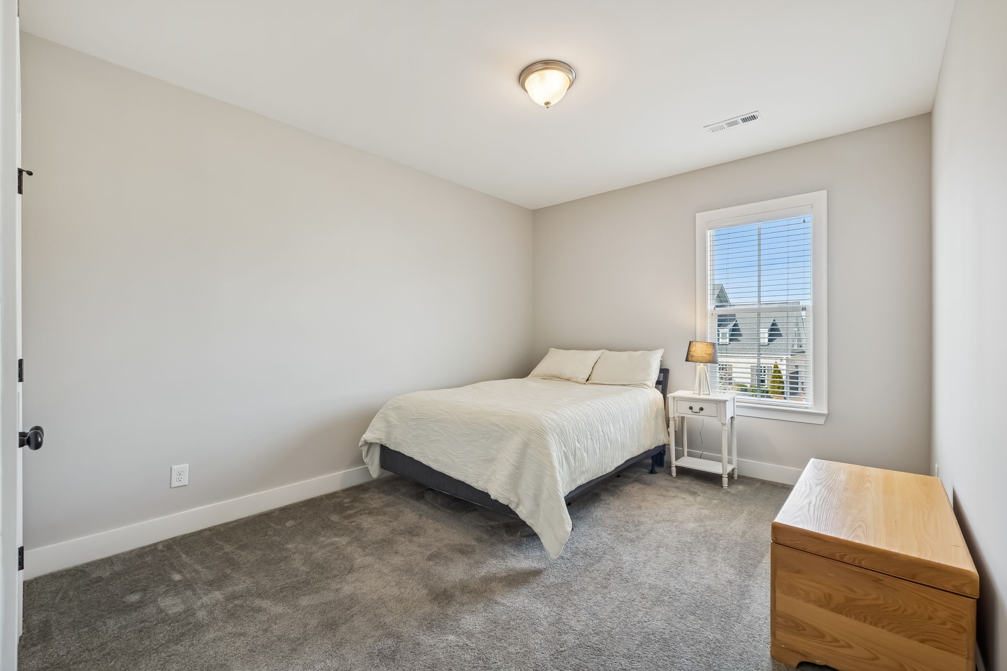 142 Vanner Road Mount Juliet, TN 37122 - Photo 36 of 52 a bedroom with a bed and a window