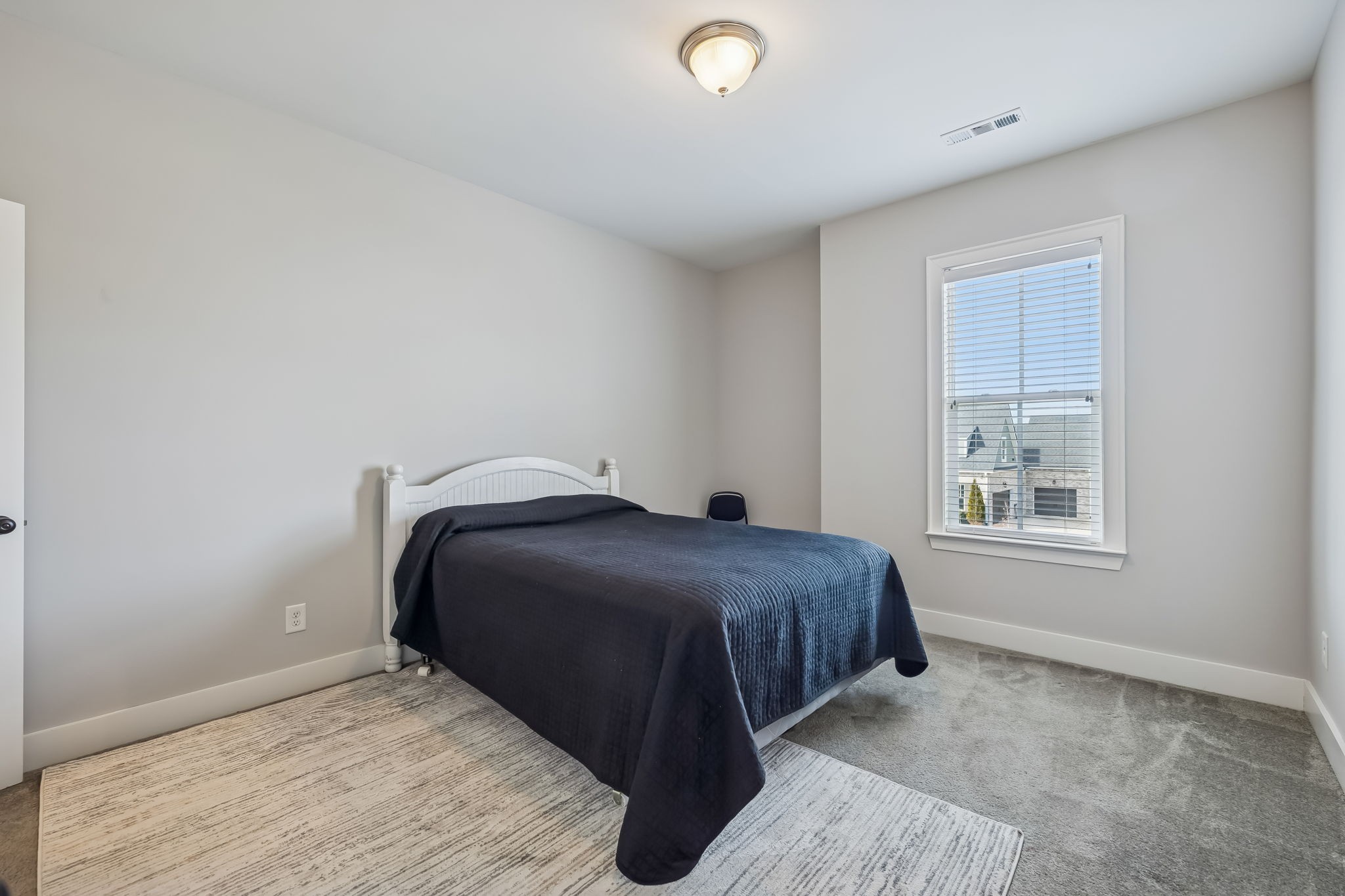 142 Vanner Road Mount Juliet, TN 37122 - Photo 37 of 52 a bedroom with a bed and window