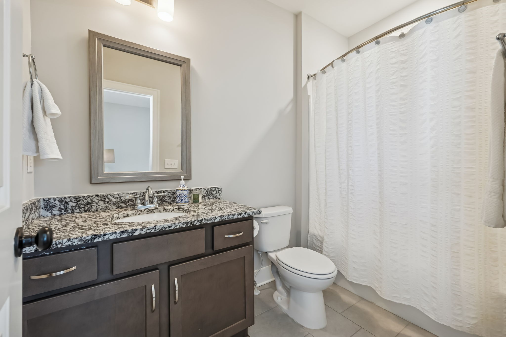142 Vanner Road Mount Juliet, TN 37122 - Photo 40 of 52 a bathroom with a granite countertop sink toilet and mirror